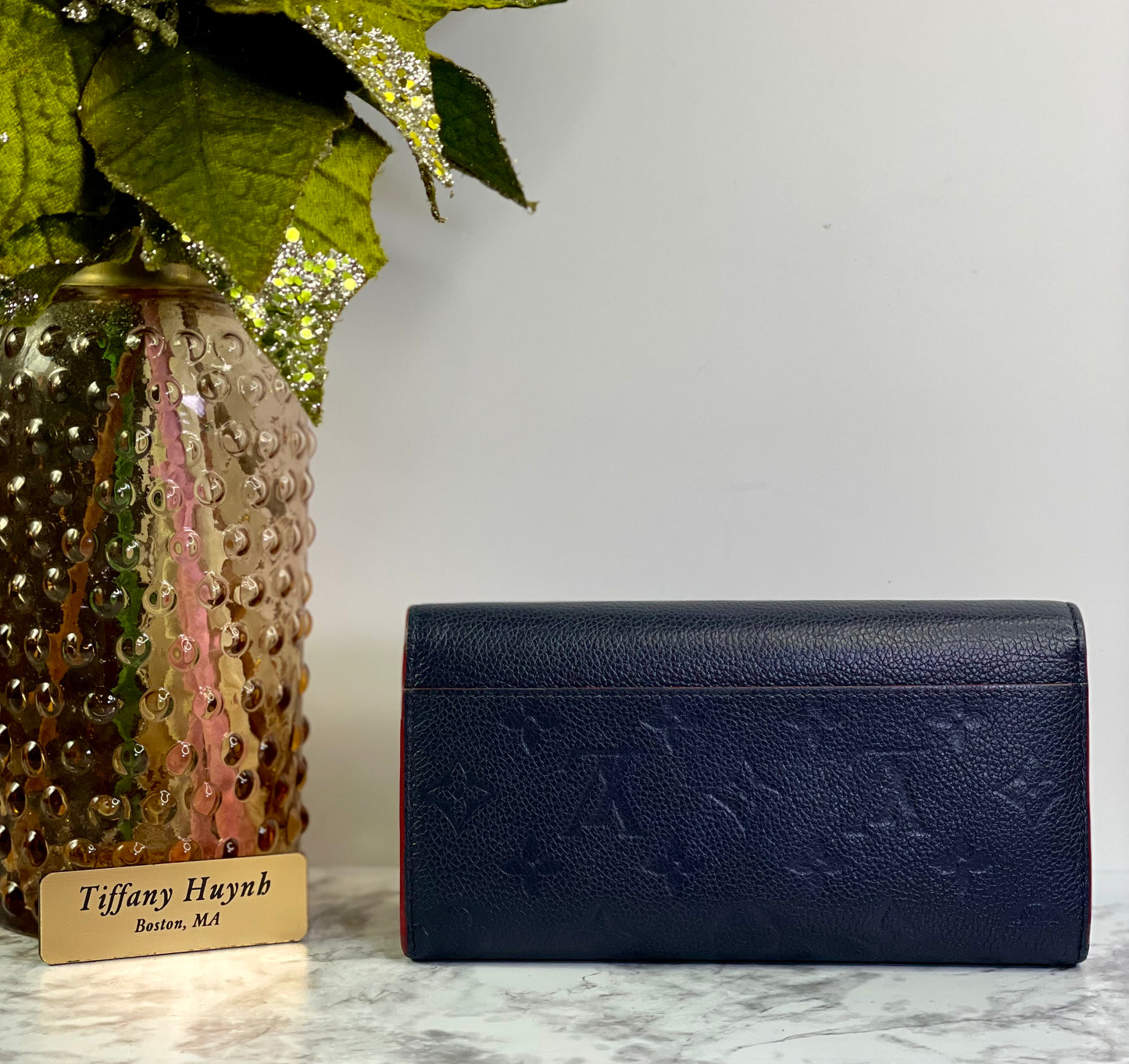 Authentic Louis Vuitton Empreinte Sarah Wallet in Marine Rouge