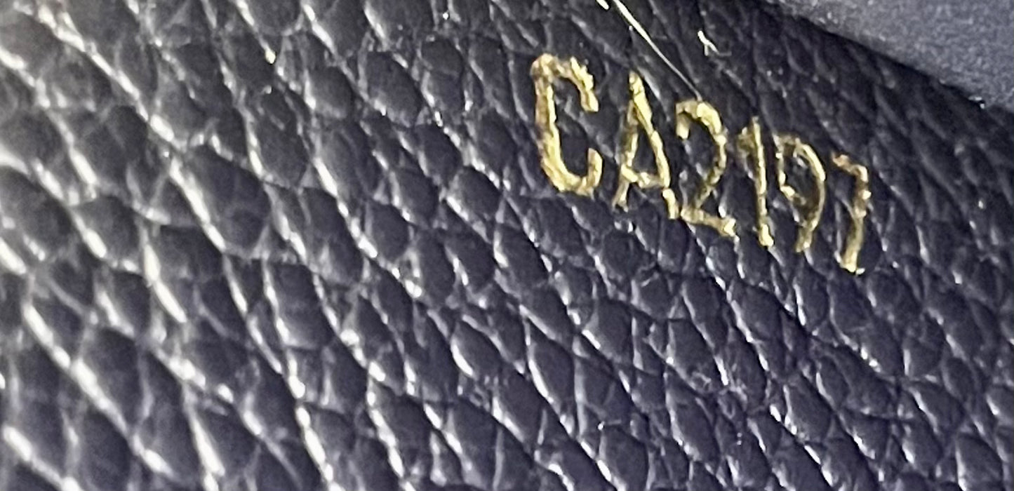 Authentic Louis Vuitton Empreinte Sarah Wallet in Marine Rouge
