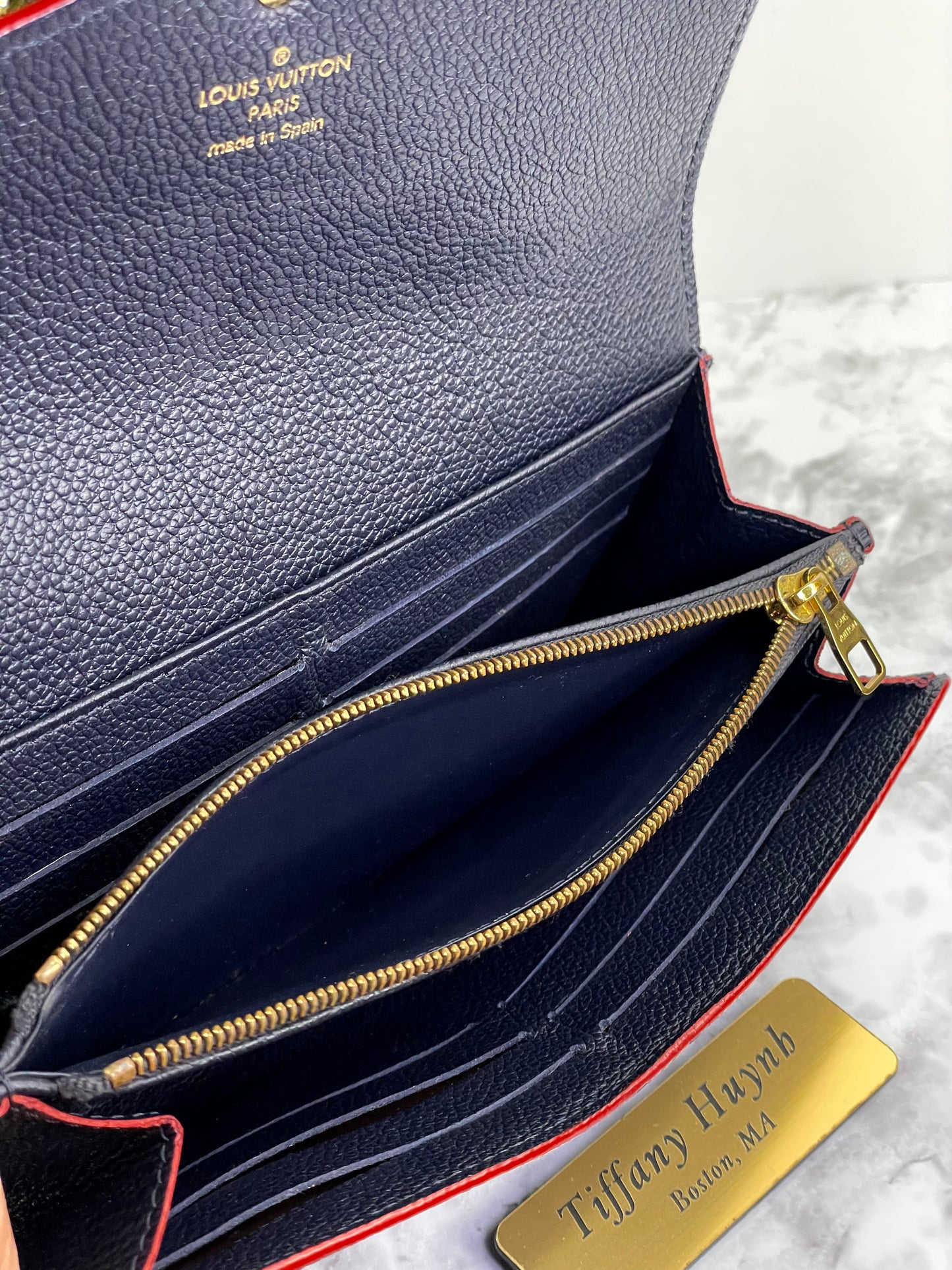 Authentic Louis Vuitton Empreinte Sarah Wallet in Marine Rouge