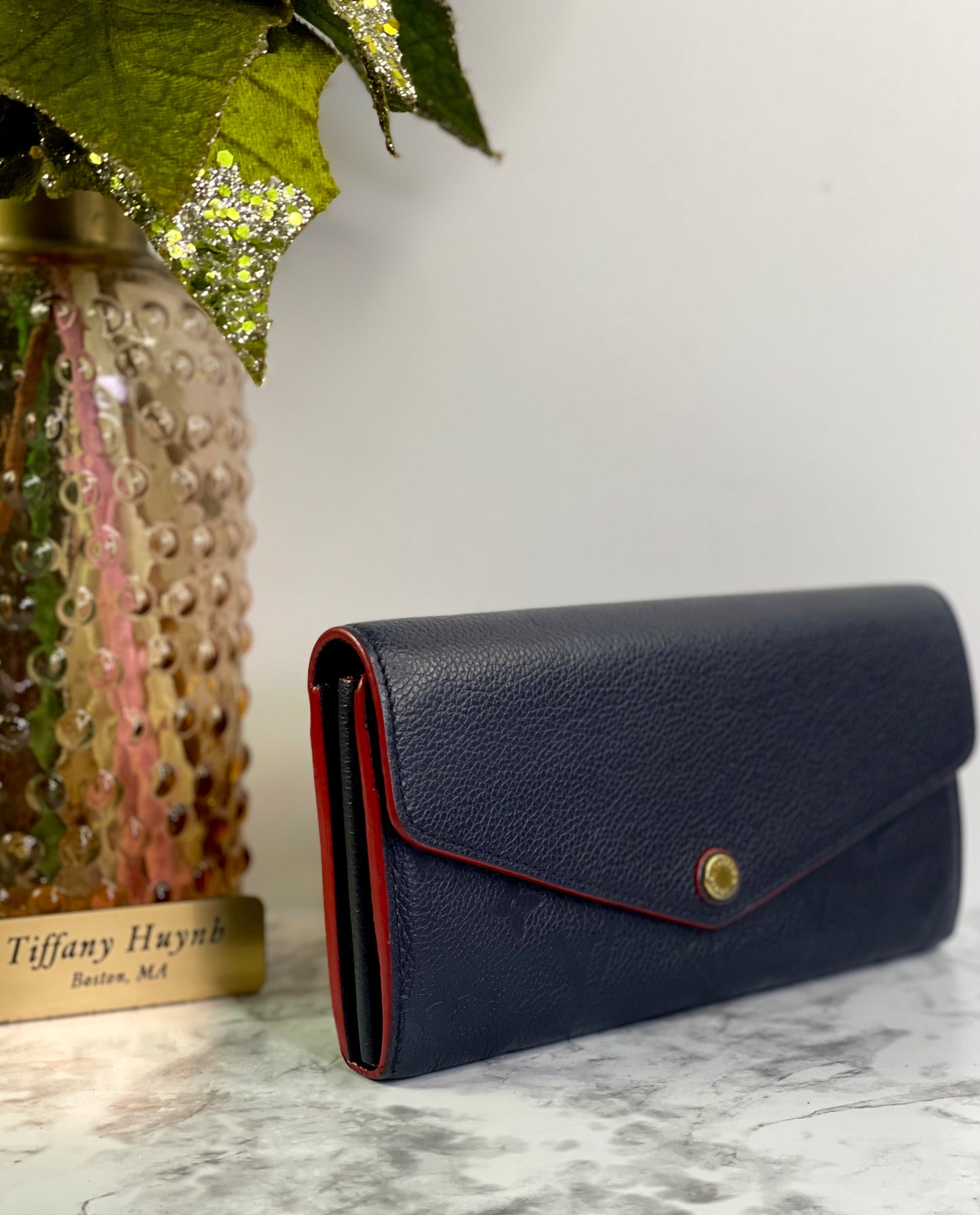 Authentic Louis Vuitton Empreinte Sarah Wallet in Marine Rouge