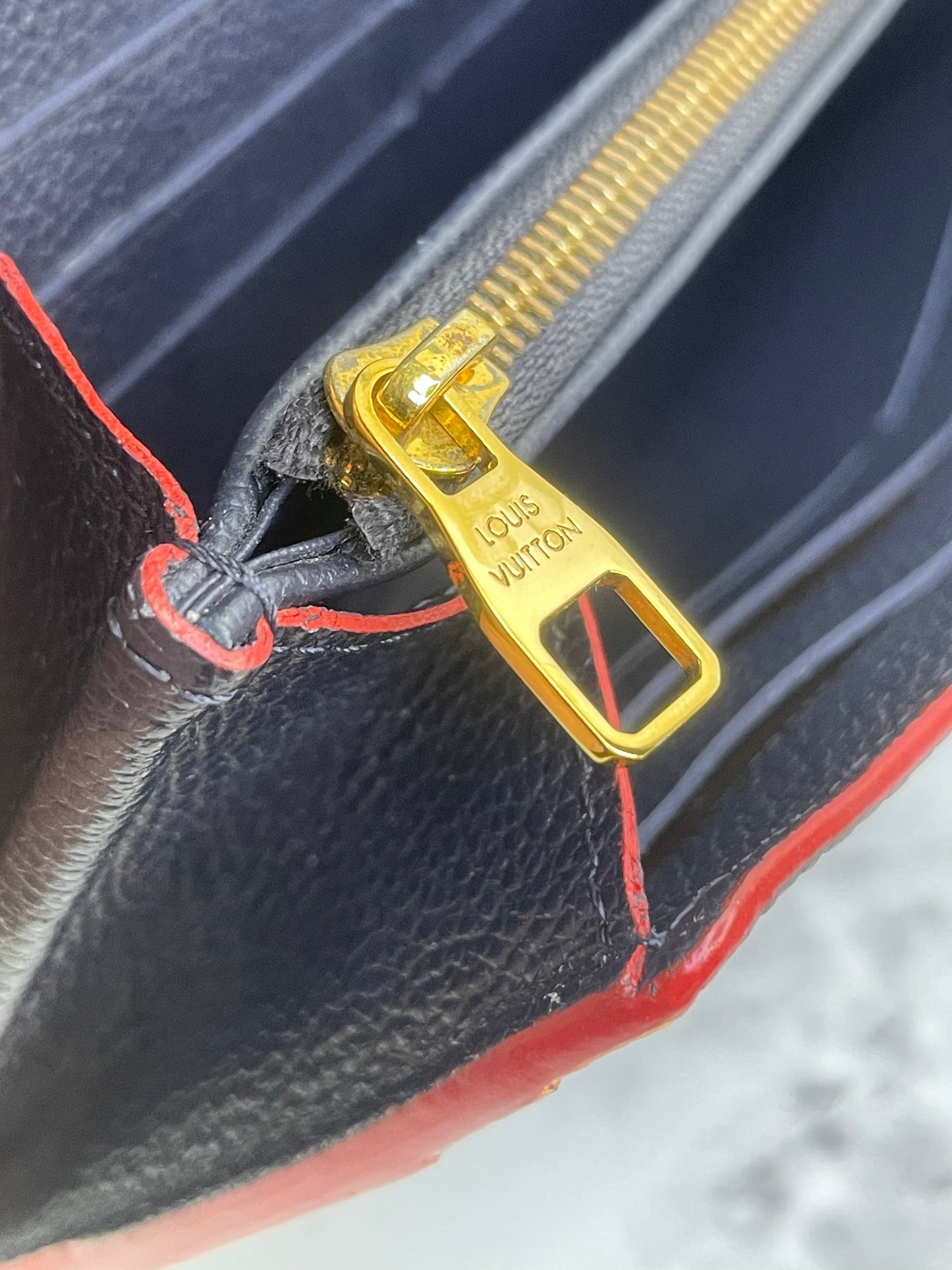 Authentic Louis Vuitton Empreinte Sarah Wallet in Marine Rouge