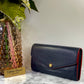 Authentic Louis Vuitton Empreinte Sarah Wallet in Marine Rouge