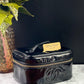 Authentic CHANEL Vanity Cosmetic Case crafted of Black Patent Leather