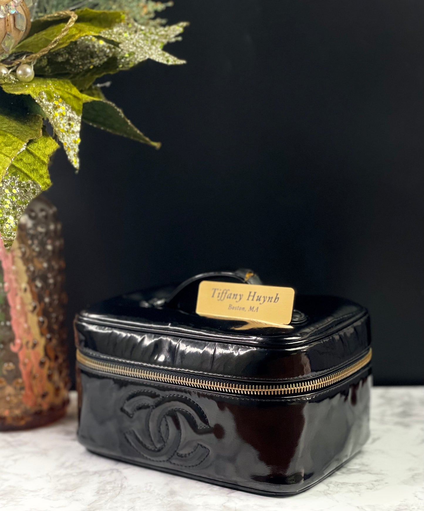 Authentic CHANEL Vanity Cosmetic Case crafted of Black Patent Leather