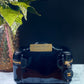 Authentic CHANEL Vanity Cosmetic Case crafted of Black Patent Leather