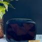 Authentic CHANEL Vanity Cosmetic Case crafted of Black Patent Leather
